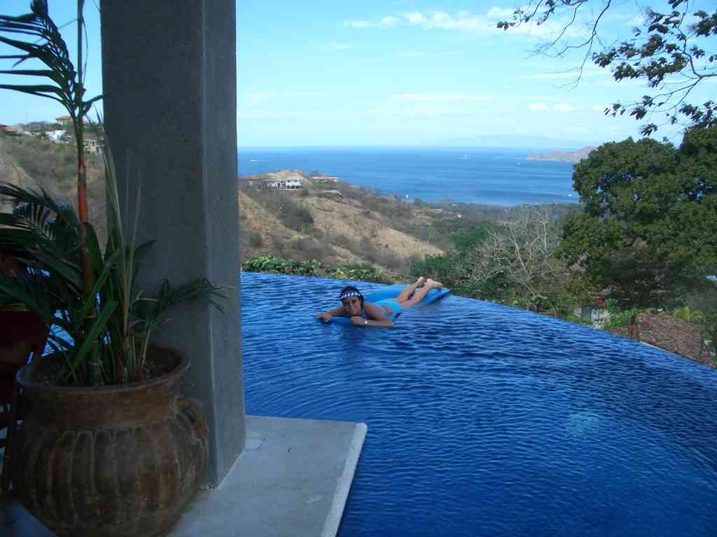 The stunning infinity pool looks like it drops right off the edge! In reality, there is a safe 4-foot-wide walkway just out of sight below.