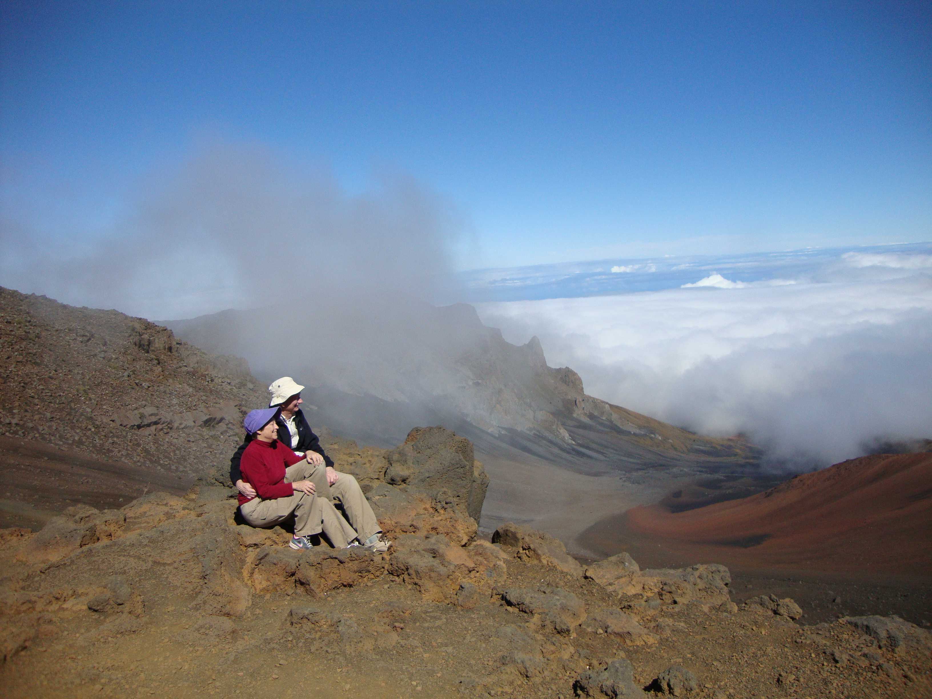 Helen and Charles enjoying the view of the crater as the clouds roll in. Since it was noon, we ate our lunch while watching the clouds completely fill the crater below.