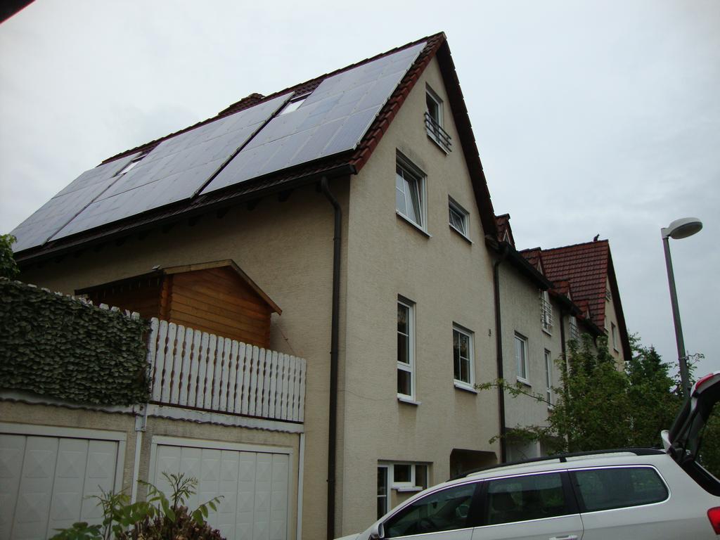 The outside of Peter's house. Notice all the solar panels! In Germany, you can sell generated power back to the grid at a higher price than you buy it.