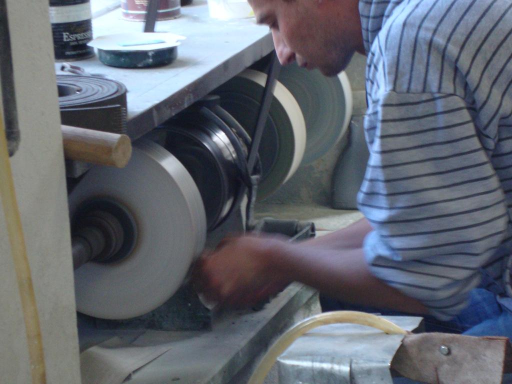 The final polishing tool used three wheels: a fine stone, an even finer stone, and finally, leather.