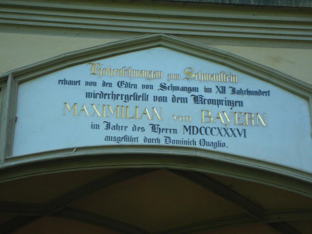 The plaque above the second archway.