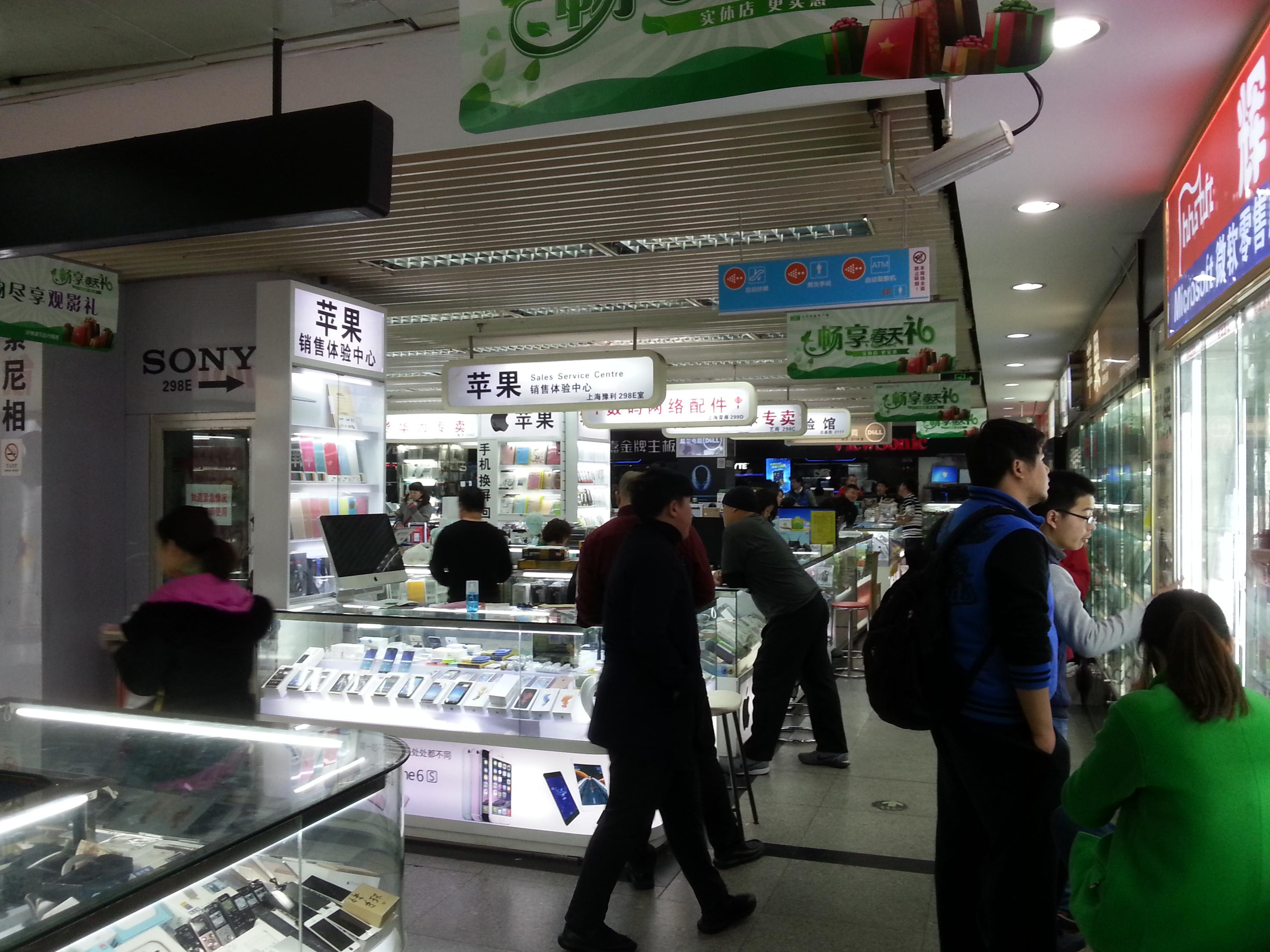 Another view down the bustling aisles of the electronics warehouse.