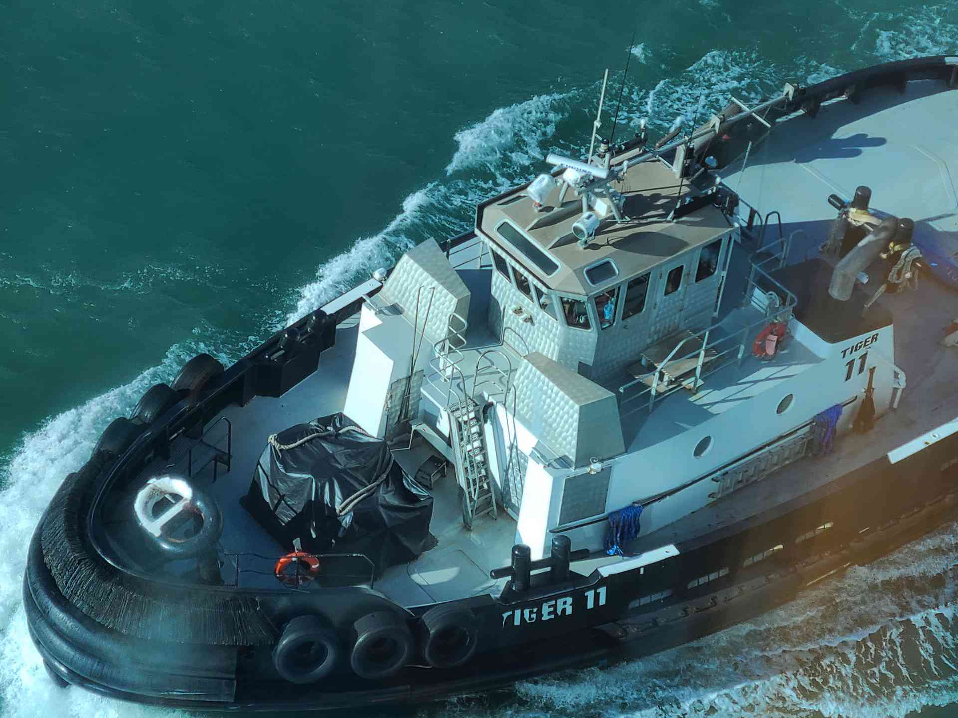Tugboats flanked the ship every single time we entered a port.