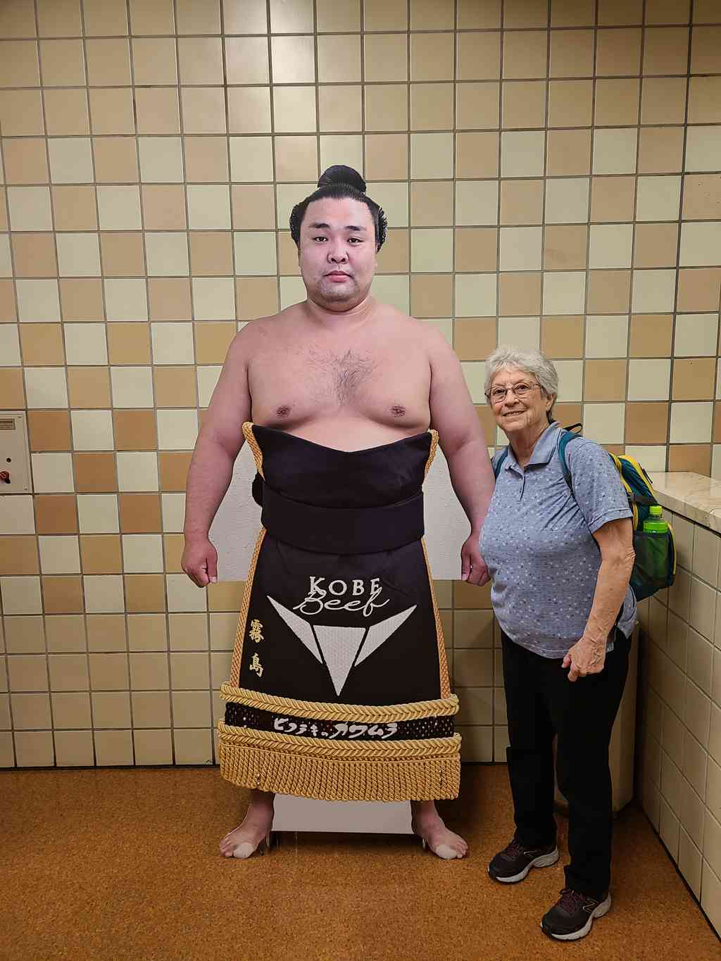 Helen having fun next to a life-size cutout of one of the 'smaller' sumo wrestlers. Look at the staggering size difference!
